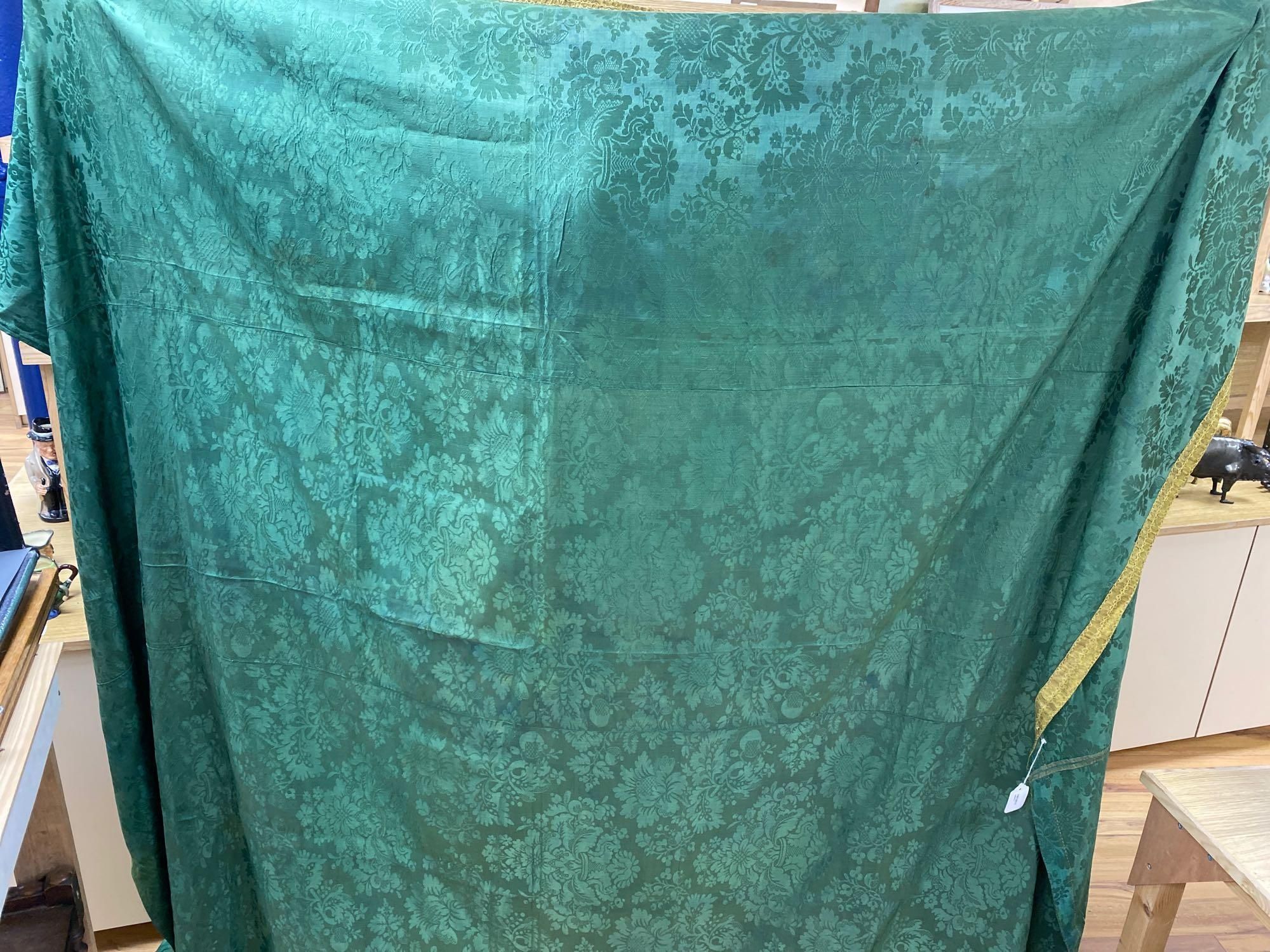 A mid-18th century joined coverlet of green silk damask,  74 x 94in (189 x 239cm)
